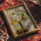 Decorative box with floral design on a patterned rug