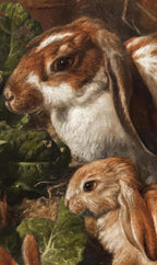 Close-up of two rabbits with green leaves in a natural setting